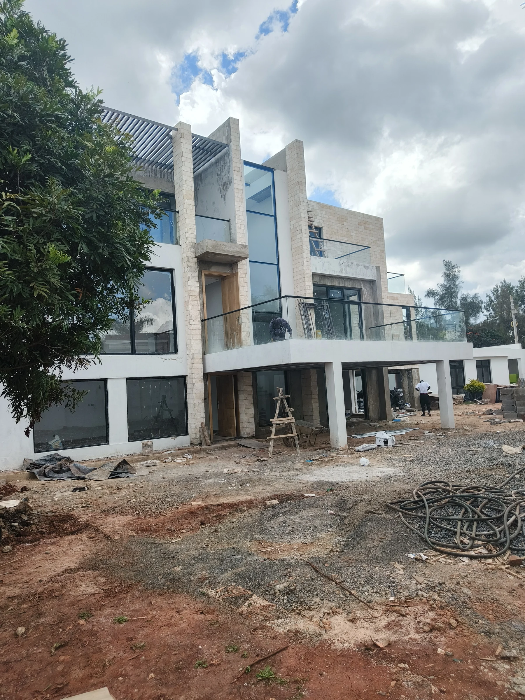Stairwell glazing and stone cladding